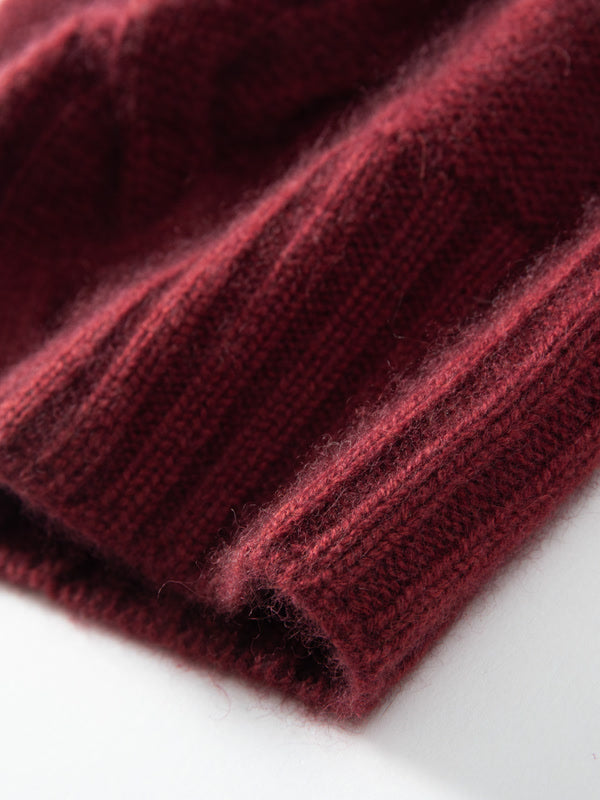 Close view of the single thickness ribbed band of a burgundy cashmere hat