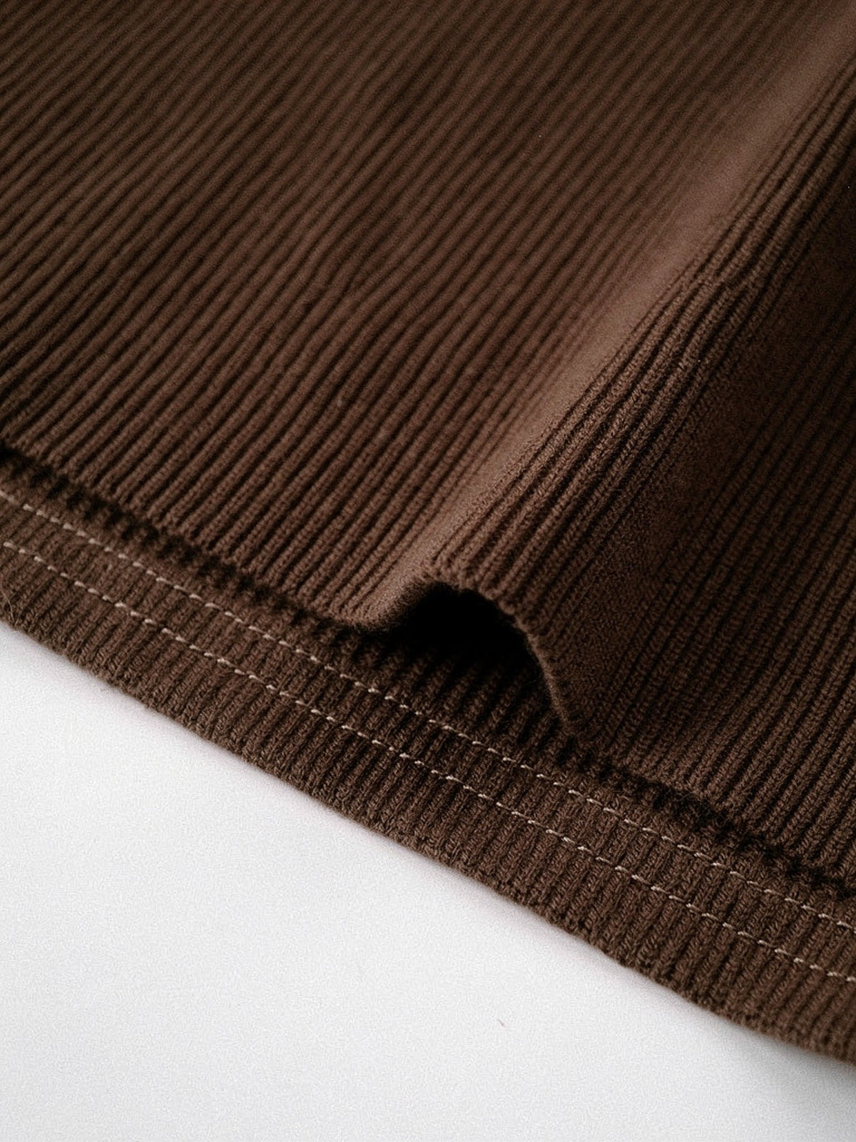Cotton rib knit detail of the brown maxi dress, fine vertical rib and stitched hem