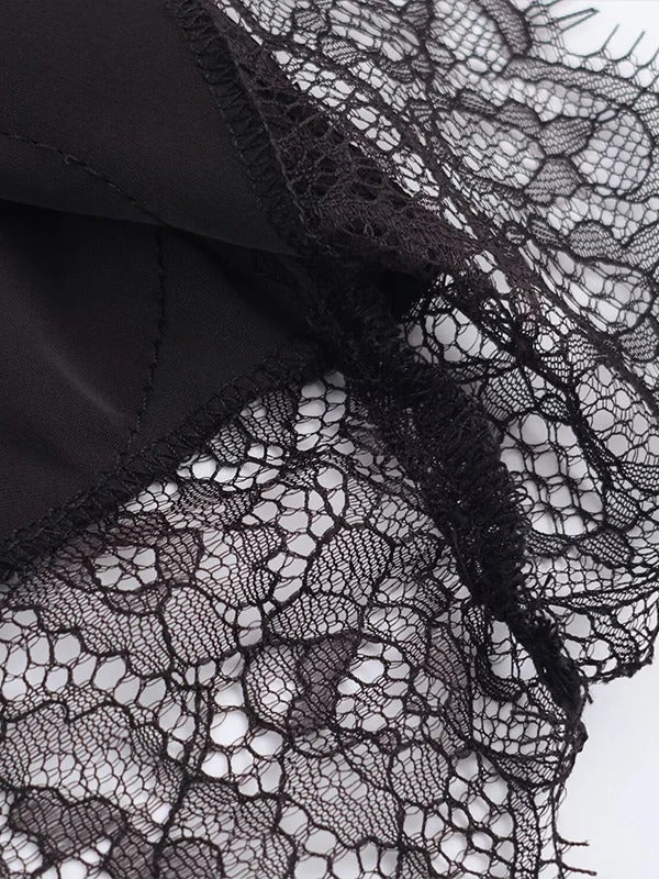 Close up of the scalloped lace hem on the satin midi skirt