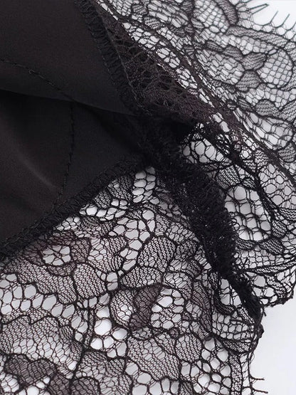 Close up of the scalloped lace hem on the satin midi skirt