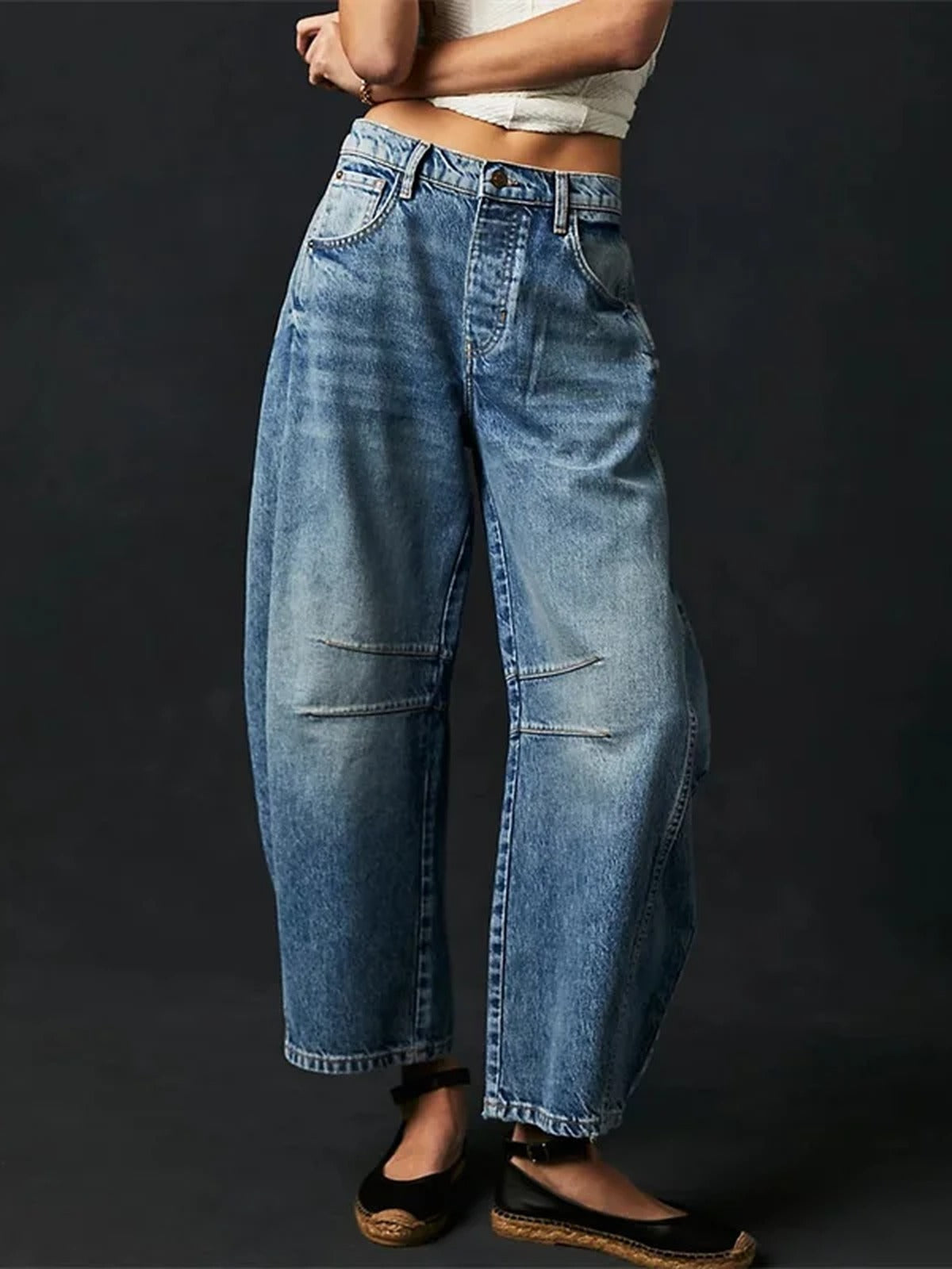 Front view of the Vintage Blue barrel jeans worn full length with flat black shoes