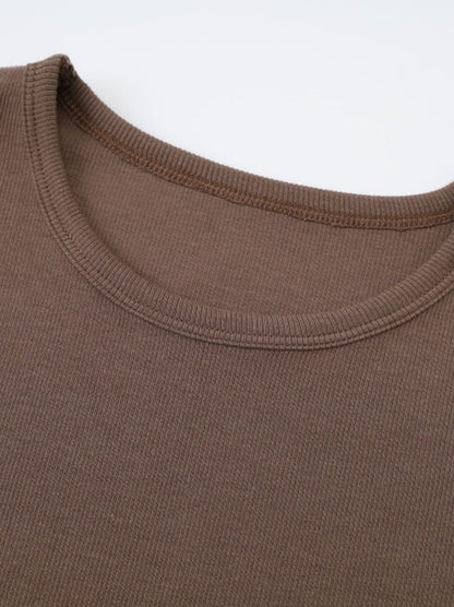Ribbed crew neckline of the brown maxi dress, bound with a narrow band of the same knit