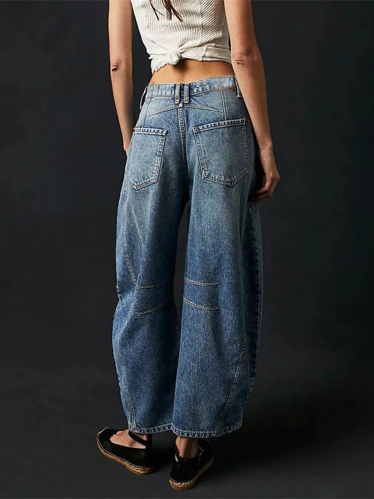 Back view of the Vintage Blue barrel jeans showing the two patch pockets and the deep V yoke