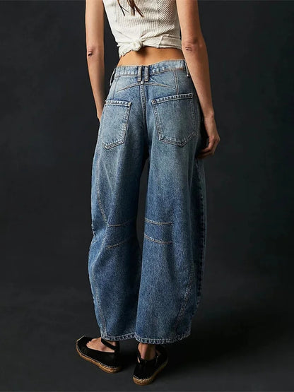 Back view of the Vintage Blue barrel jeans showing the two patch pockets and the deep V yoke