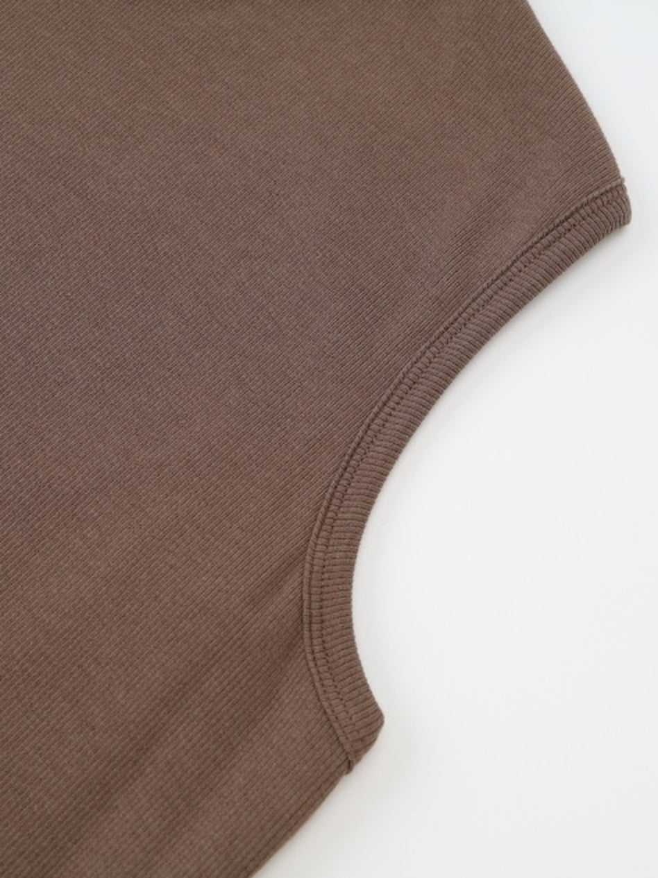 Bound armhole of the sleeveless brown maxi dress, narrow rib binding