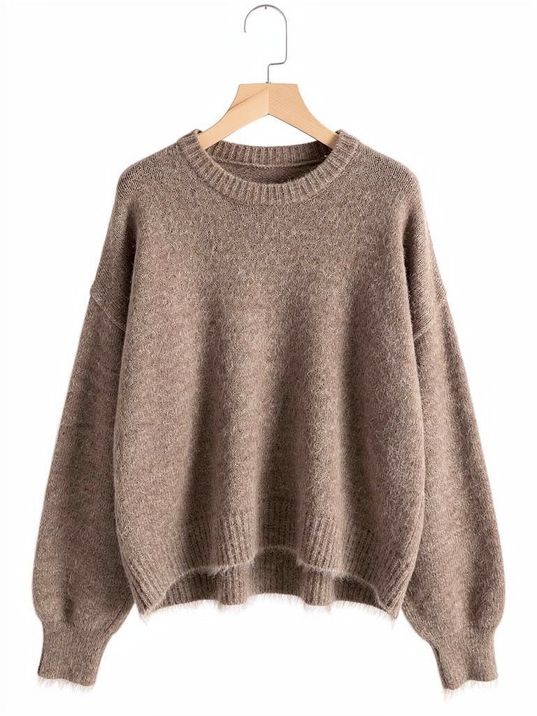 Cappuccino brushed alpaca jumper on a wooden hanger, showing the round neck and dropped shoulders