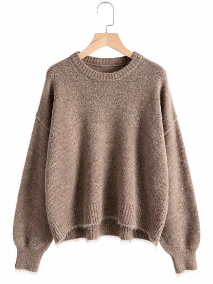 Cappuccino brushed alpaca jumper on a wooden hanger, showing the round neck and dropped shoulders