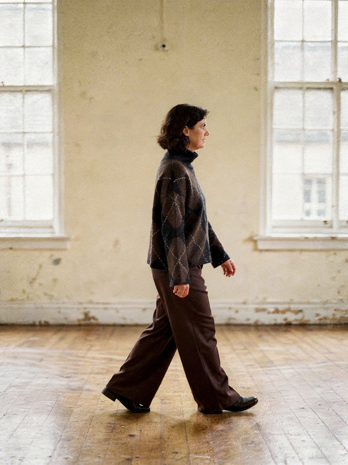 Side view of the argyle jumper showing the dropped shoulder and wide straight sleeve