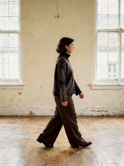 Side view of the argyle jumper showing the dropped shoulder and wide straight sleeve