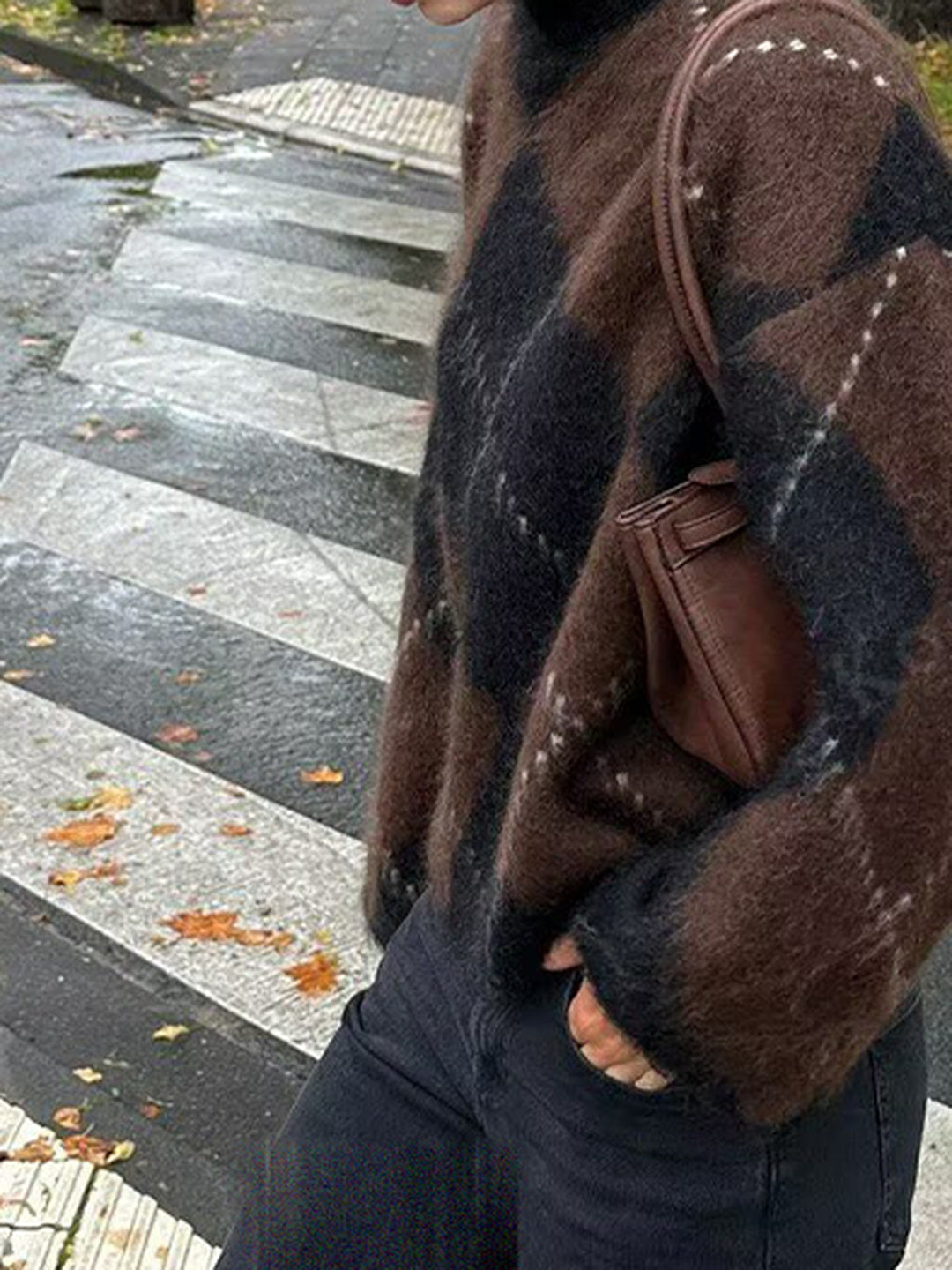 Argyle jumper worn with black jeans, showing the short boxy body and long sleeves