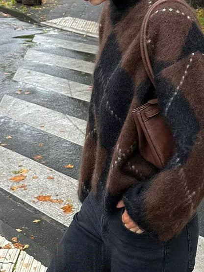 Argyle jumper worn with black jeans, showing the short boxy body and long sleeves
