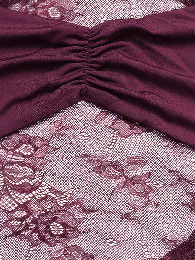 Close-up of the ruched jersey bust panel meeting the floral lace waist band of the Mulberry lace dress