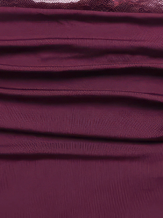 Close-up of the soft side ruching on the mini skirt of the Mulberry lace dress