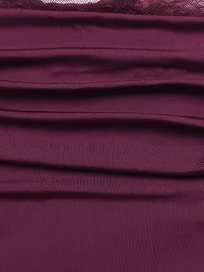 Close-up of the soft side ruching on the mini skirt of the Mulberry lace dress