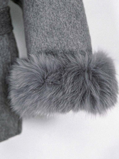 Close up of the deep faux fur cuff and brushed cloth of the belted coat