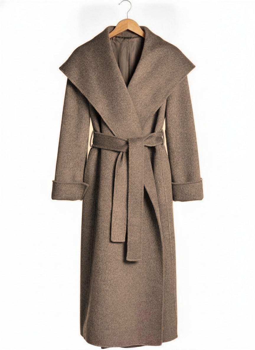 Belted wrap coat in Hickory taupe on a wooden hanger, showing the deep shawl collar, the tied belt and the deep turn back cuffs