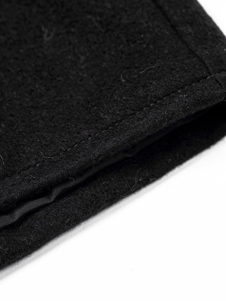 Close up of the brushed black cloth and the stitched front edge of the coat