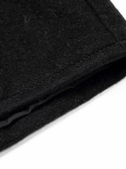 Close up of the brushed black cloth and the stitched front edge of the coat