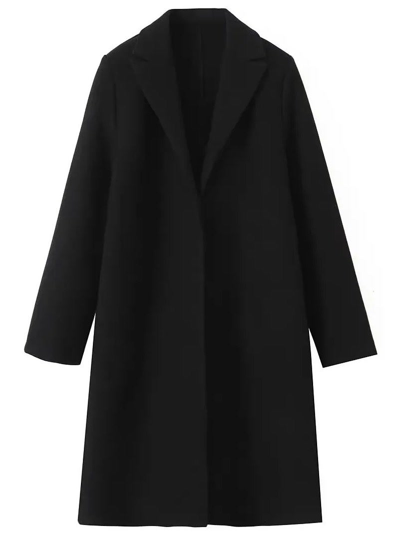 Black coat laid flat, showing the full longline cut and the open edge to edge front