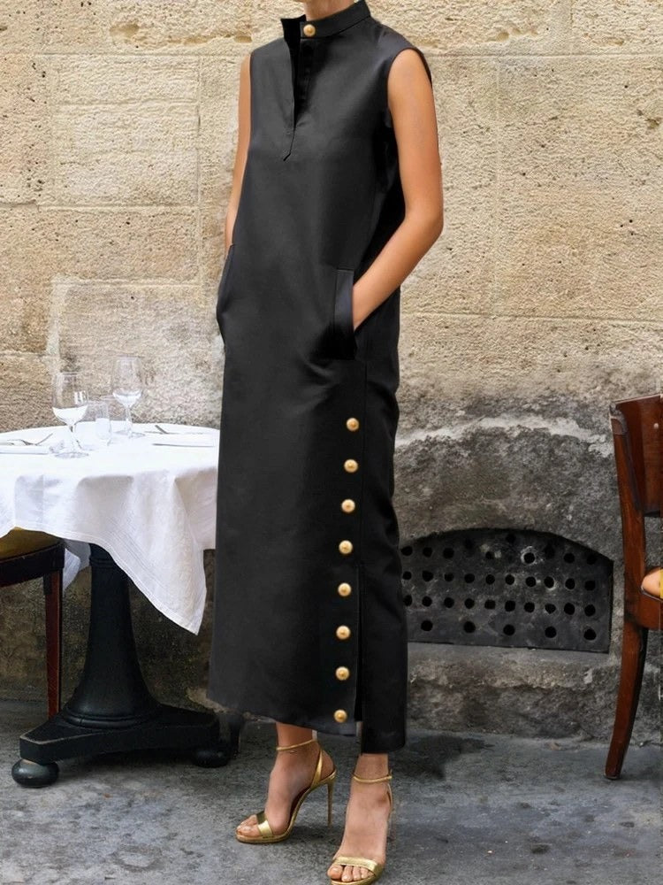 Black column dress worn full length, three quarter view