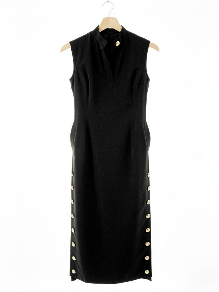 Black column dress on a hanger, showing the stand collar and the gilt buttons down each side seam