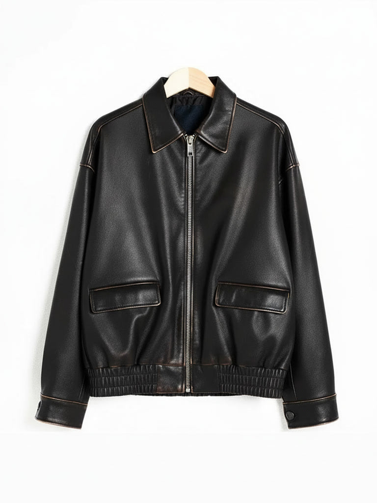 Distressed faux leather bomber jacket on a hanger, front view, in Char faded black