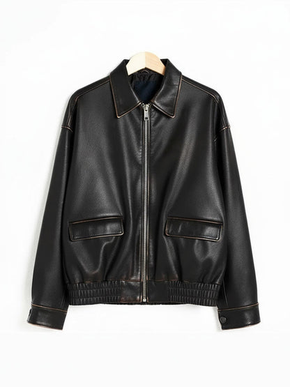 Distressed faux leather bomber jacket on a hanger, front view, in Char faded black