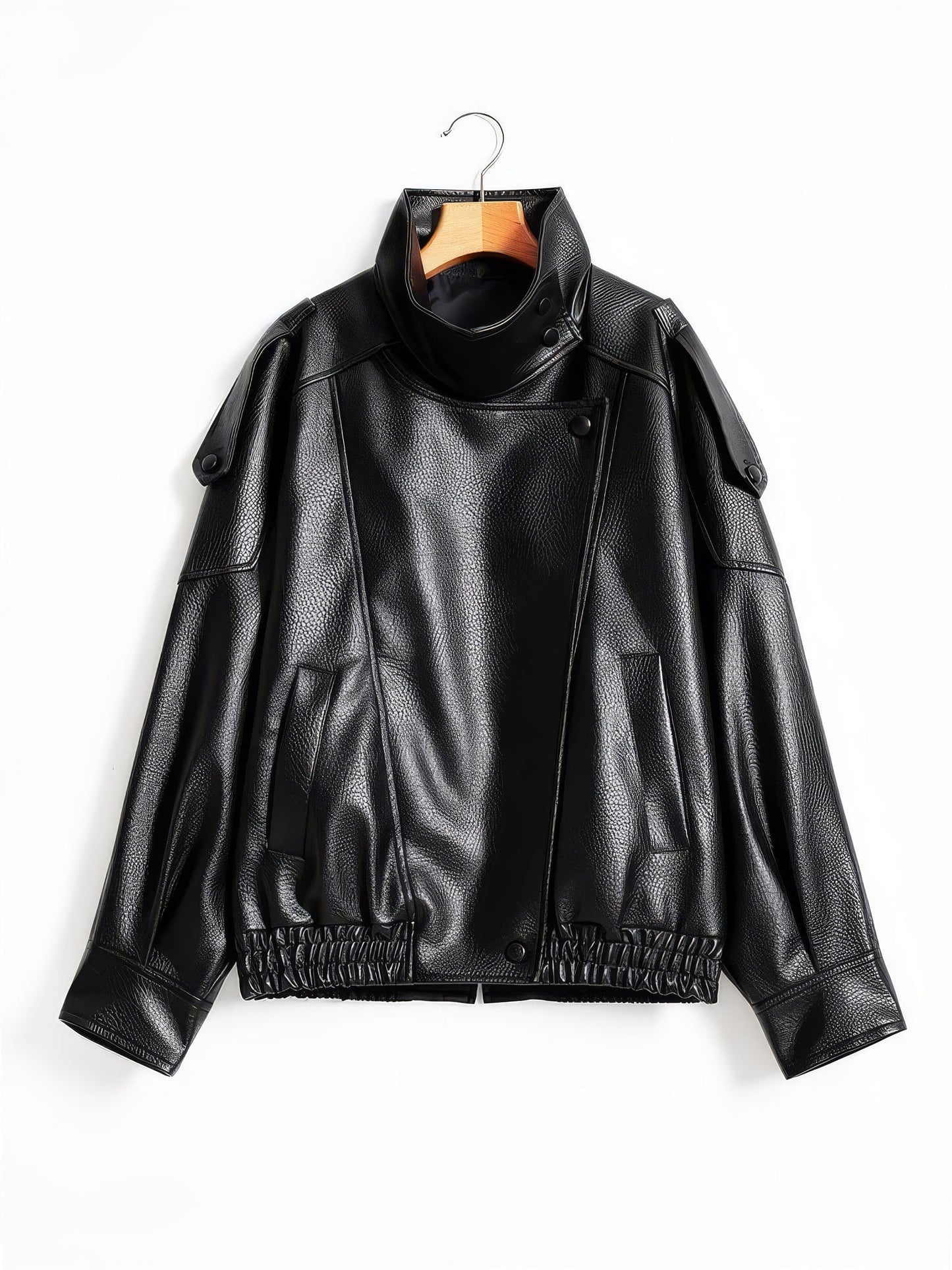 Black faux leather jacket with asymmetric press-stud front on a wooden hanger