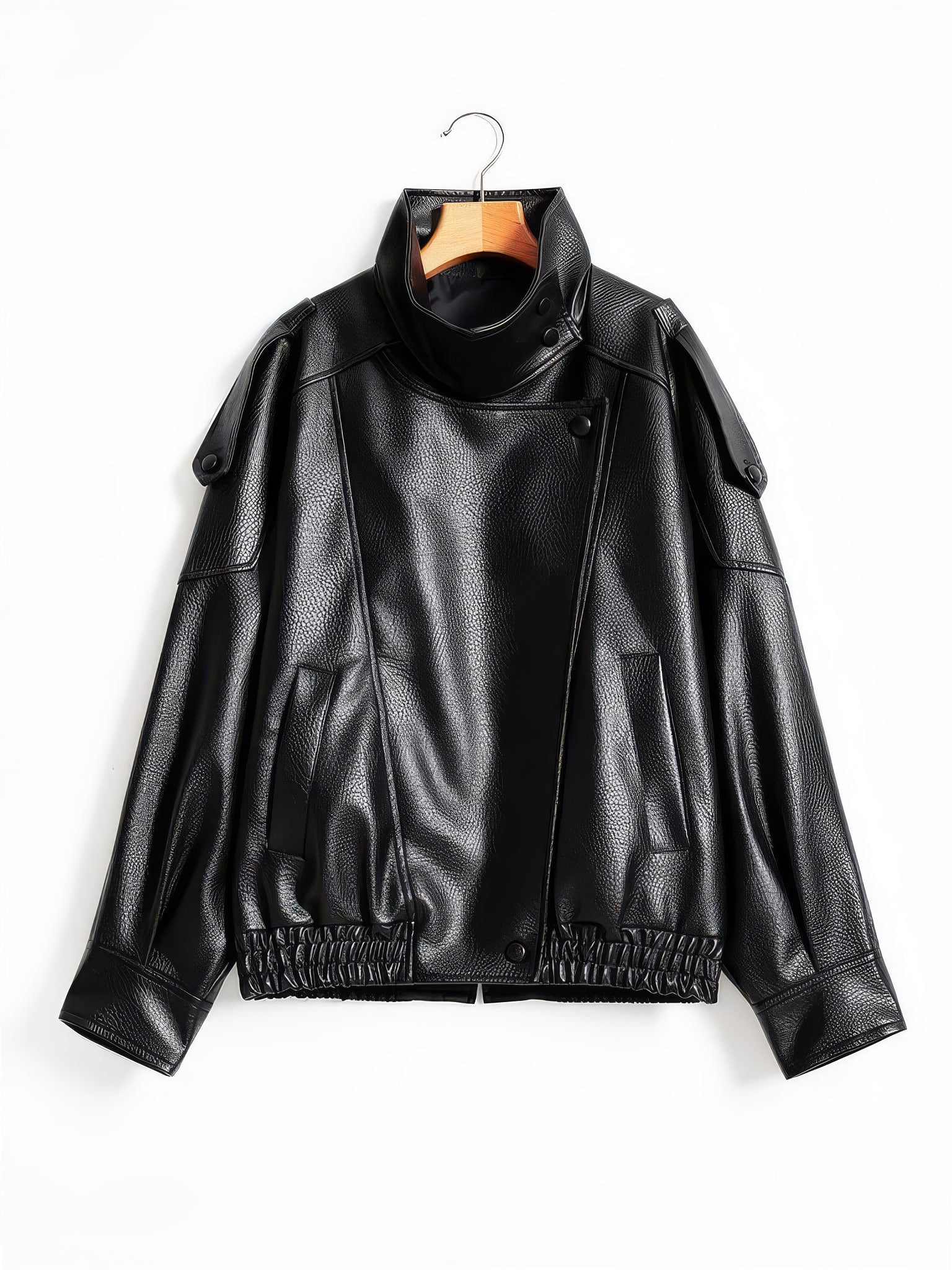 Black faux leather jacket with asymmetric press-stud front on a wooden hanger
