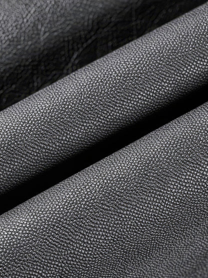 Close up of the fine grain on the black faux leather trousers