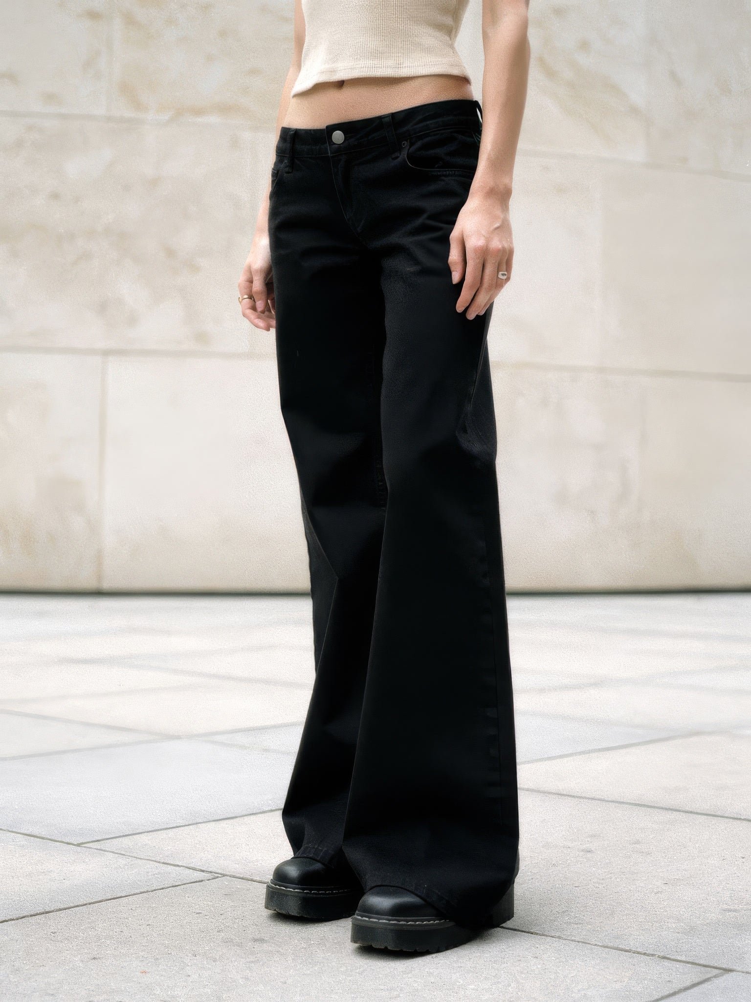 Black flare jeans in washed denim worn full length with a wide flare - Brackley