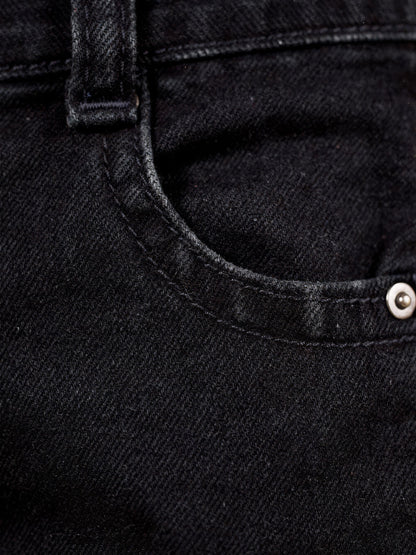Washed black denim close-up with five-pocket and topstitch detail - Brackley