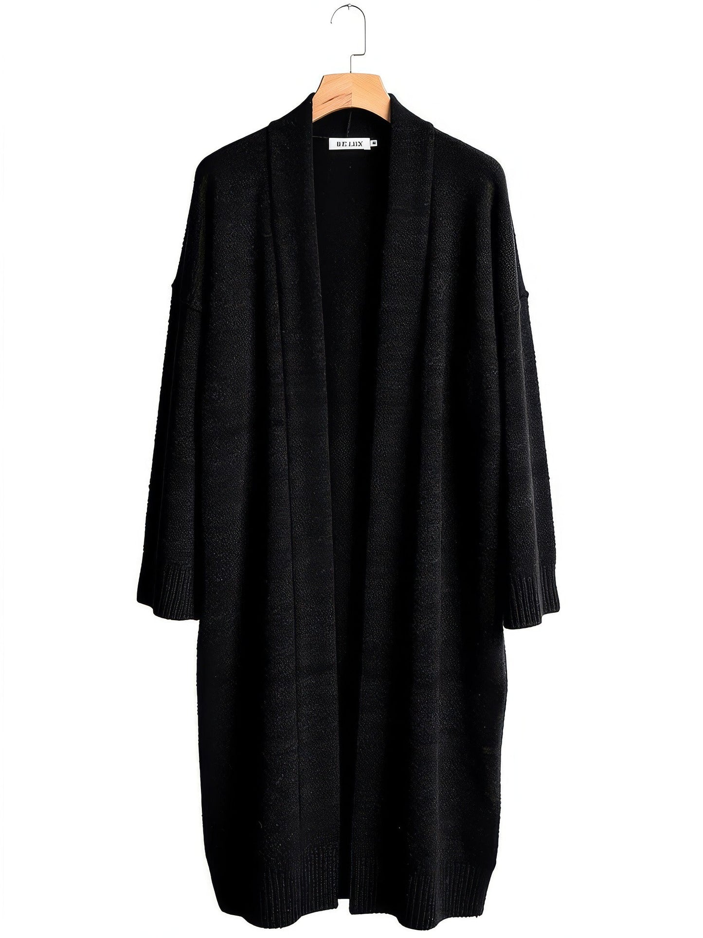 Black longline chunky knit coatigan on a wooden hanger
