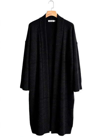 Black longline chunky knit coatigan on a wooden hanger