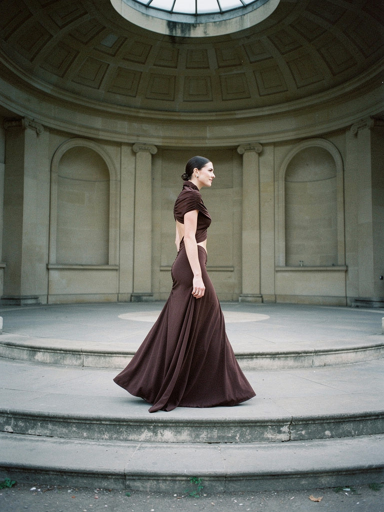 Chicory brown maxi dress with a ruched mesh bodice, worn walking in a domed stone rotunda