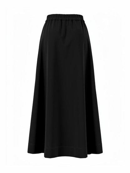 Back of the black midi skirt, plain and unpleated with an elasticated gathered waistband