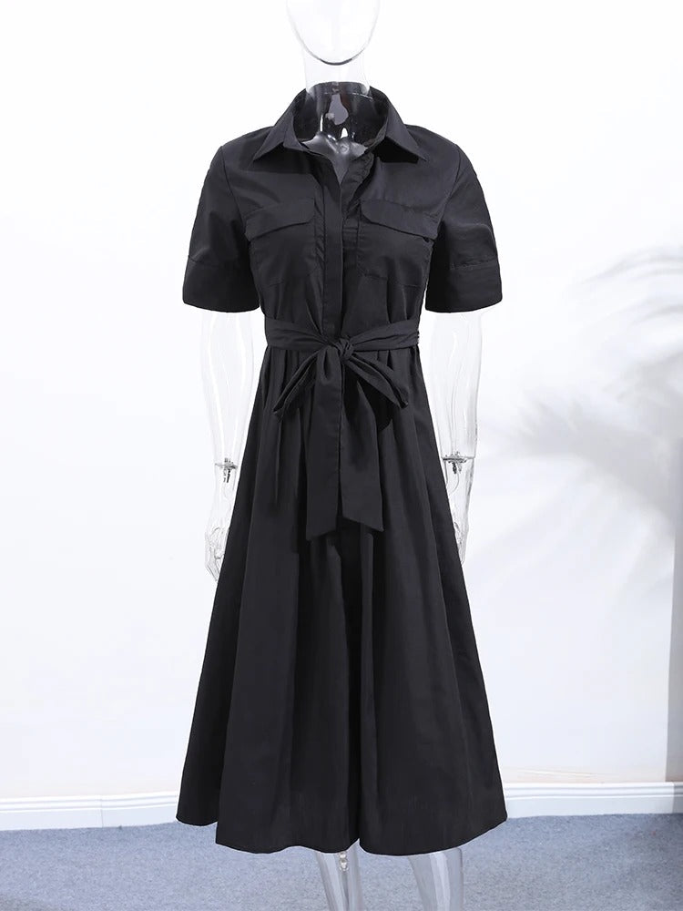 Black shirt dress shown front on from collar to hem