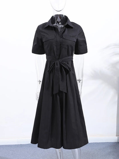 Black shirt dress shown front on from collar to hem