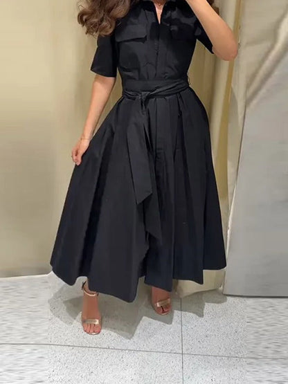Black shirt dress worn with the self-fabric belt tied at the waist