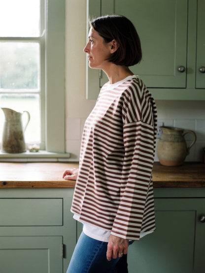 Side view of the oversized breton stripe top showing the dropped shoulder and wide sleeve