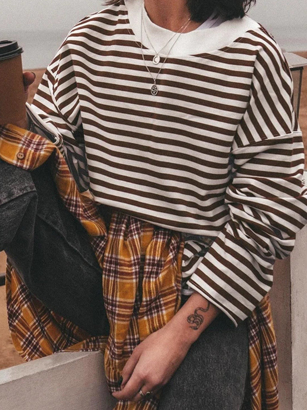 Cocoa brown breton stripe top worn with a checked skirt, real product photograph