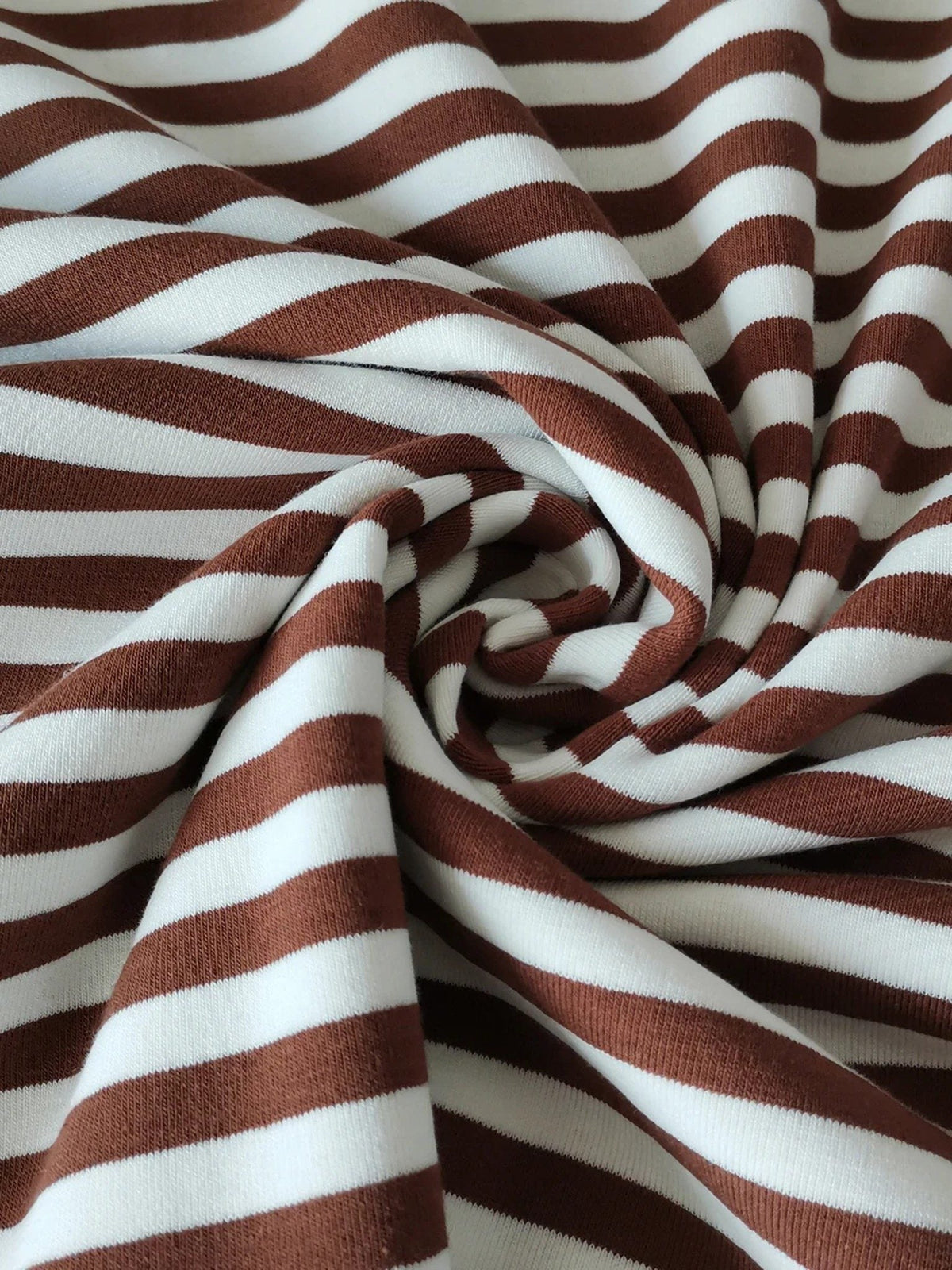 Close up of the soft mid-weight striped jersey fabric of the breton stripe top