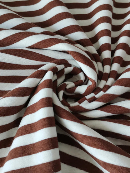Close up of the soft mid-weight striped jersey fabric of the breton stripe top