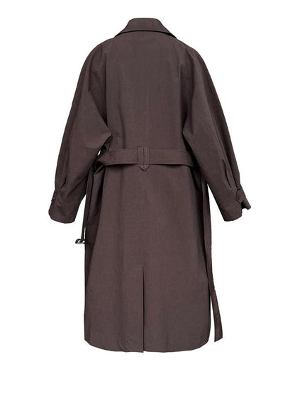 Back view of the brown coat showing the half belt and the centre back vent
