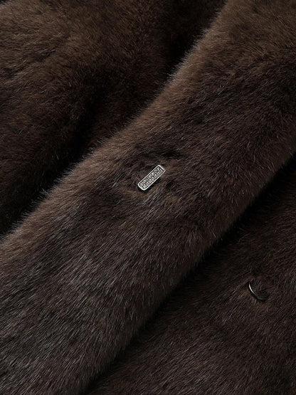 Detail of the crystal set hook fastening on the front of the brown faux fur coat
