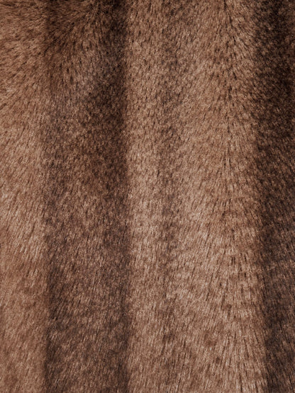 Close up of the short glossy faux fur pile with its soft vertical bands