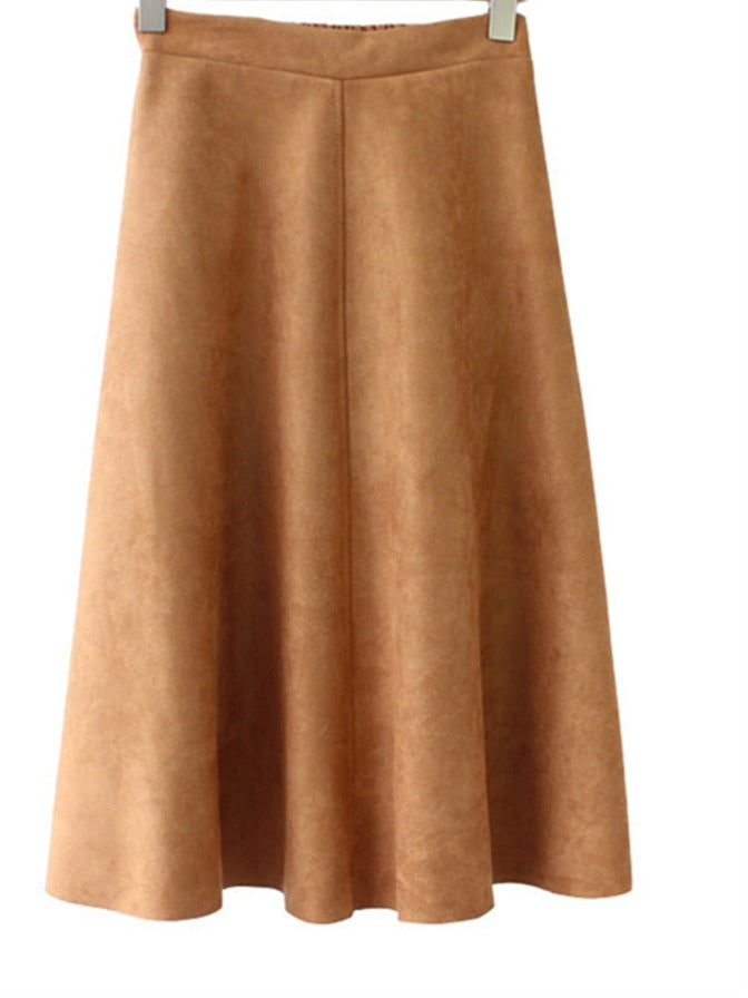 Maker photograph of the faux suede skirt in Sienna from the front, the shaped waistband and the single centre front seam visible