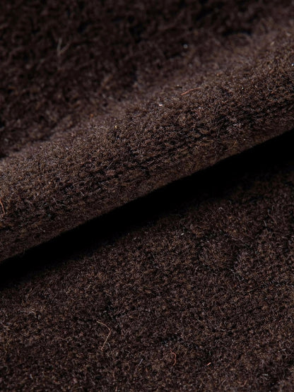 Close up of the matte brushed cloth of the brown A line midi skirt