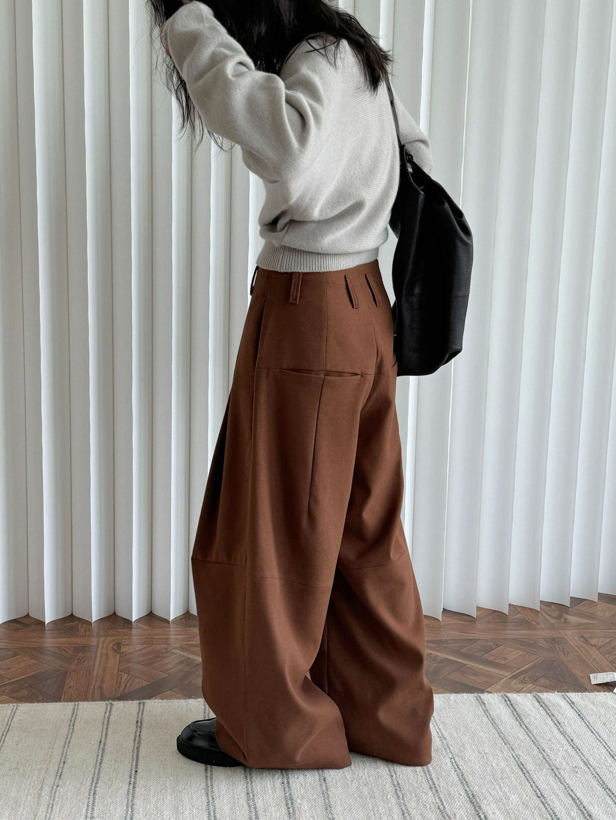 Brown trousers in Russet, back view, full length