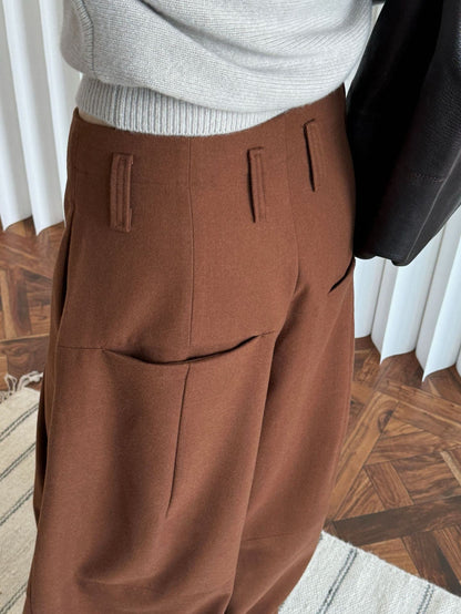 Tailored waistband and belt loops of the Russet brown trousers